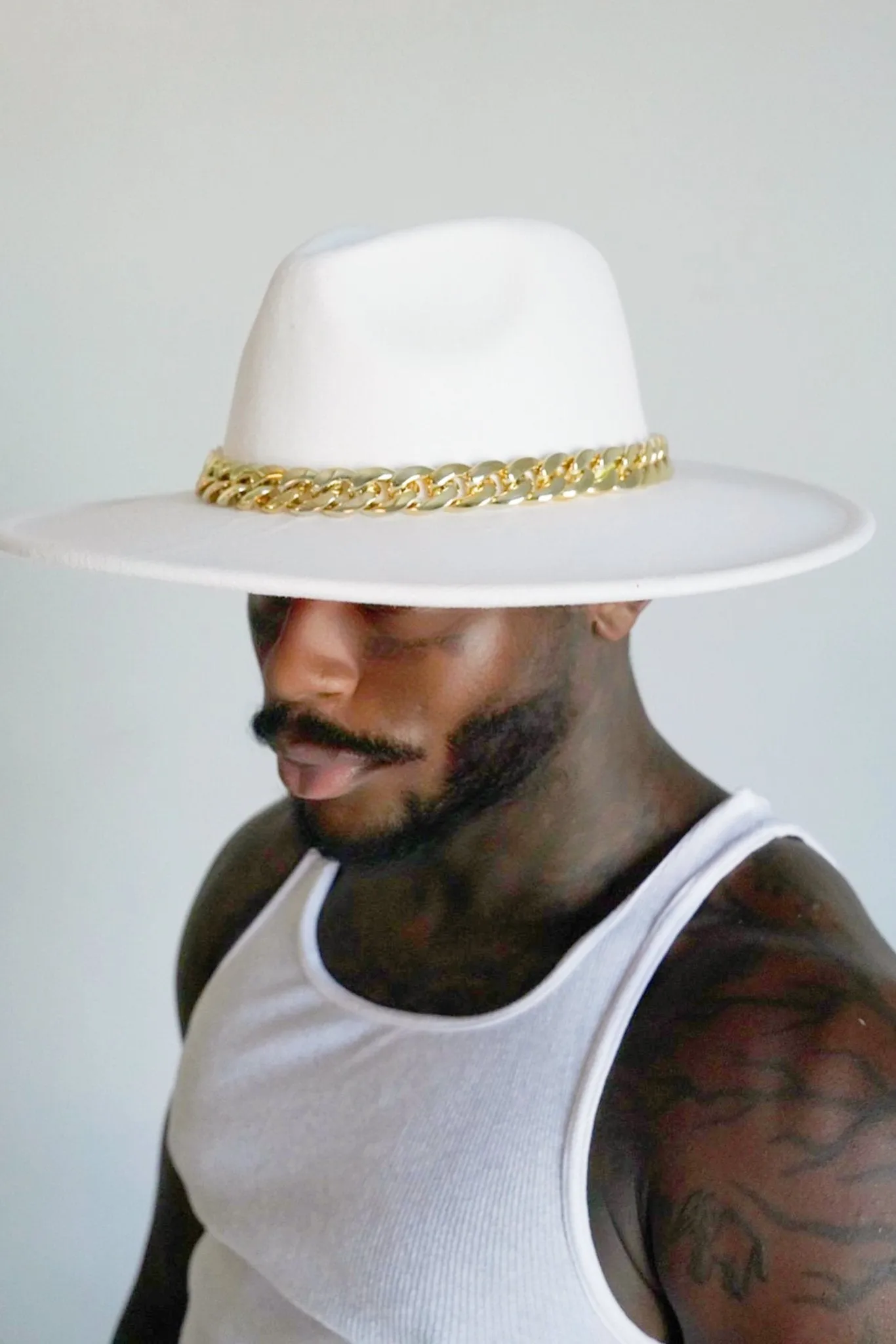 Classic White Fedora with Gilded Chain and Crimson Accent